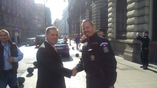 Ambassador welcoming a police officer